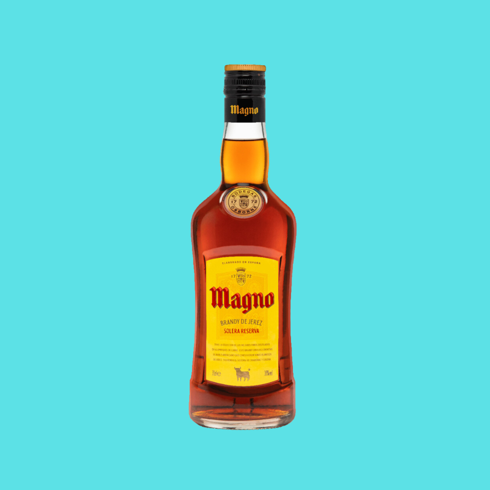 Bottle of Magno Brandy de Jerez Solera Reserva with a rich mahogany color.